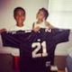 Game Truck Rental, Gaming Bus Rental, Gamer vs Gamer VIP Truck Client Kash Wita's Children Holding A Football Jersey And Smiling While Sharing Their Experience
