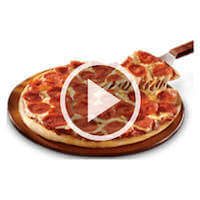 A video play button of our gamebus rental serving food inside our game truck rentals 